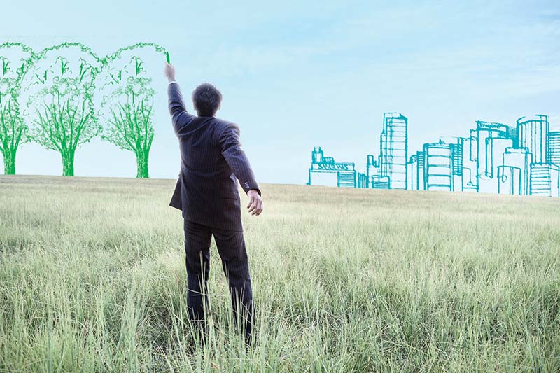 Социальное предпринимательство Indian businessman drawing trees on sky