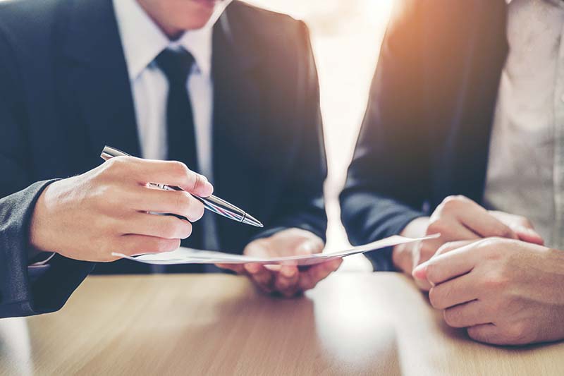 SBH Law Offices Business people Meeting negotiating a contract between two colleagues