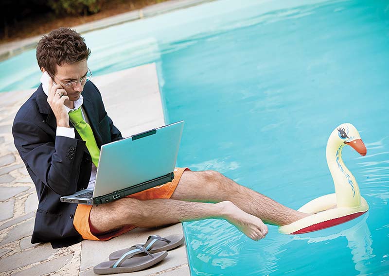 Корпоративная культура Funny Young Businessman with SwimmingTrunks next to the Pool